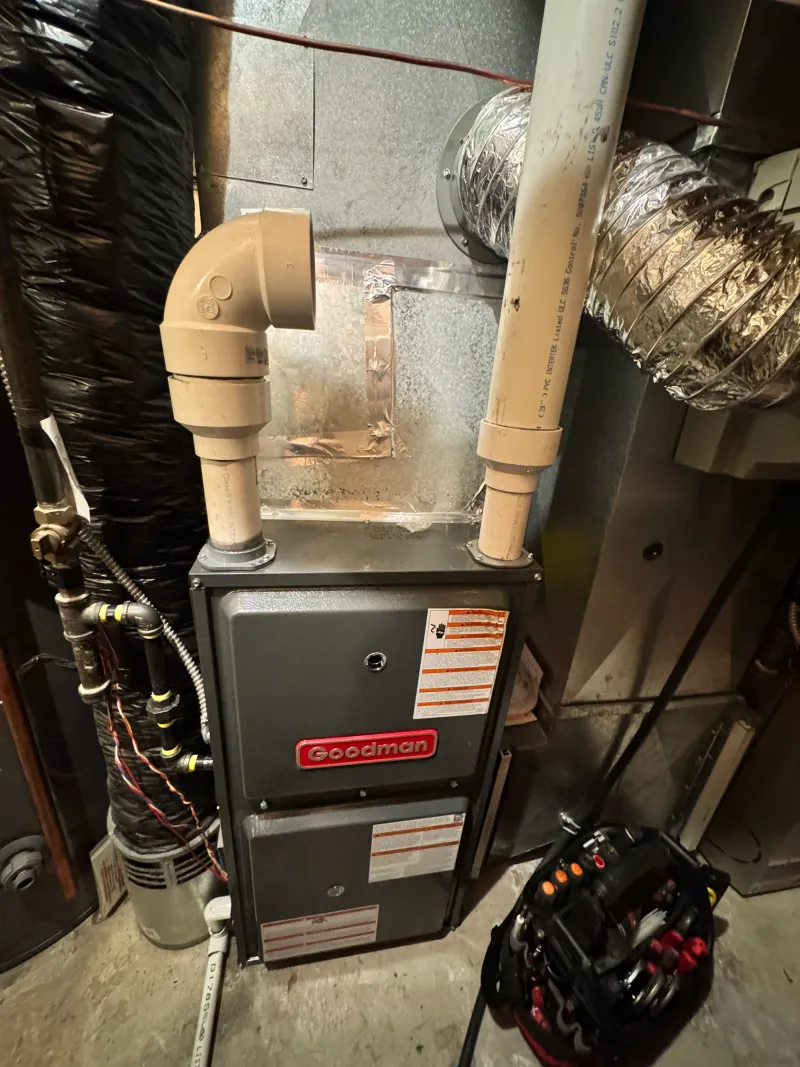 High-efficiency Goodman furnace installed by Wagner Mechanical in a Calgary basement