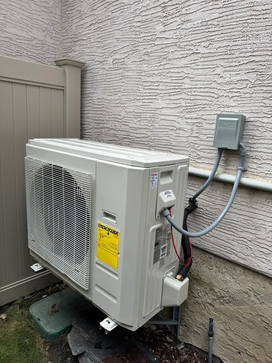 Side discharge AC condenser unit professionally installed in Calgary by Wagner Mechanical