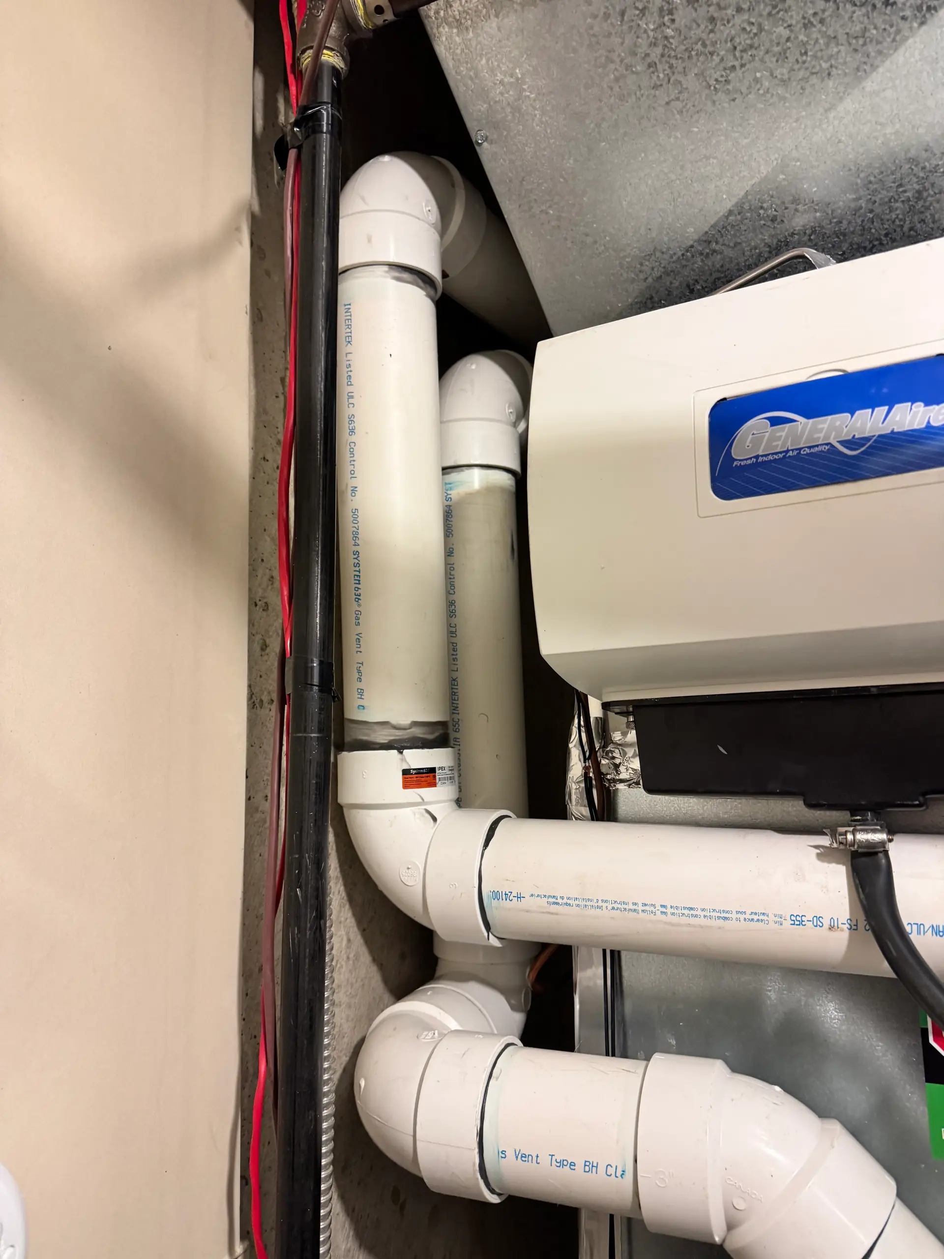 Whole-home humidifier installed on a furnace by Wagner Mechanical in Calgary